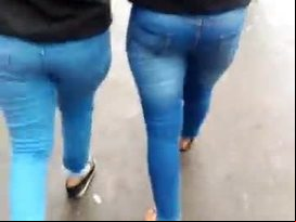 Two indian babes walking in tight blue jeans